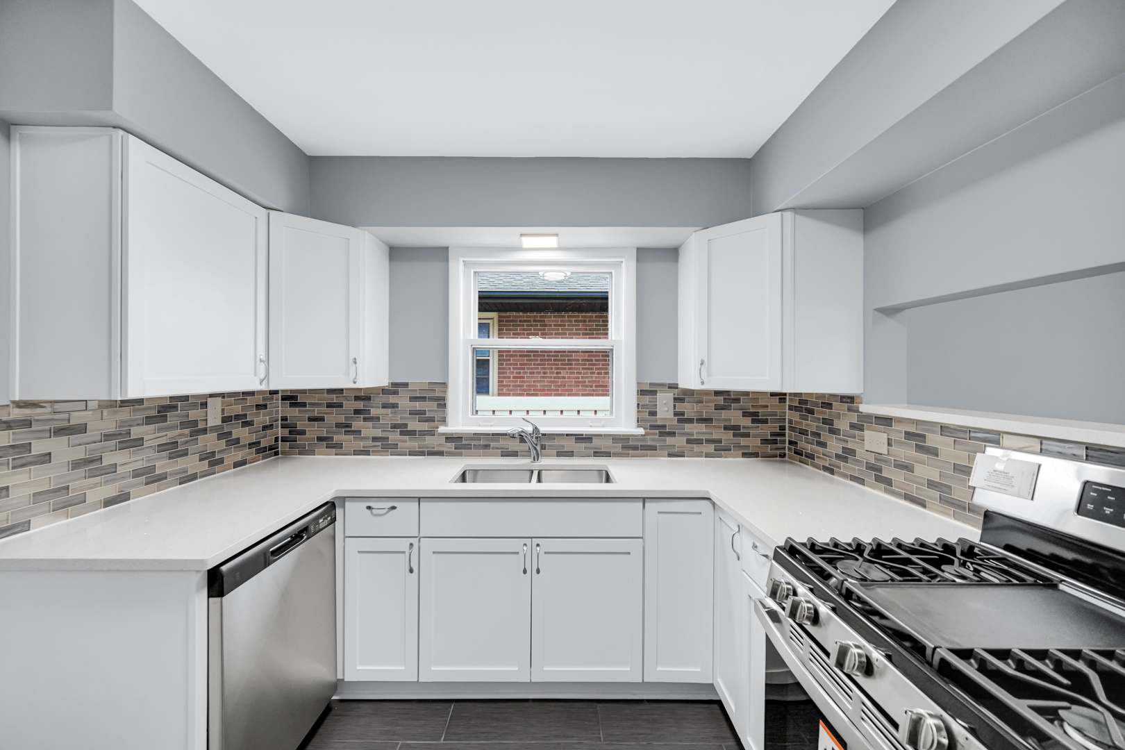 1522 186th Street Homewood, IL 60430 - Photo 13 of 22 a kitchen with granite countertop a sink stove and cabinets