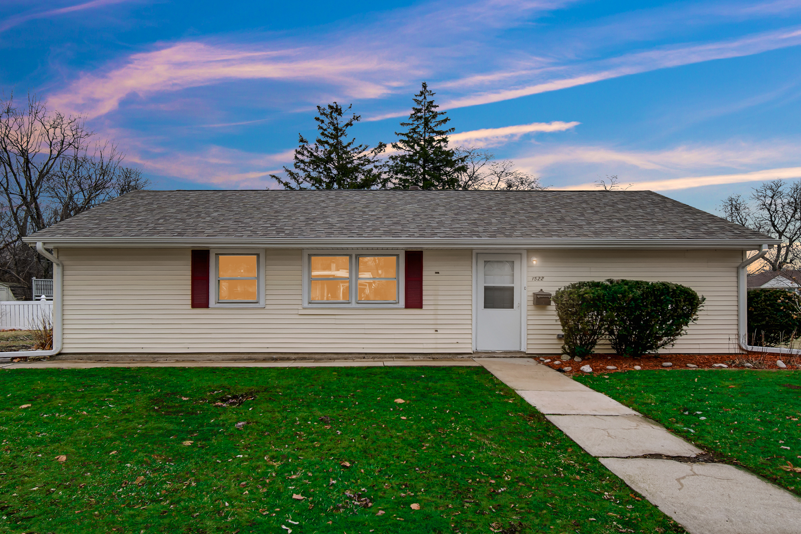1522 186th Street Homewood, IL 60430 - Photo 2 of 22 a front view of a house with a garden and yard