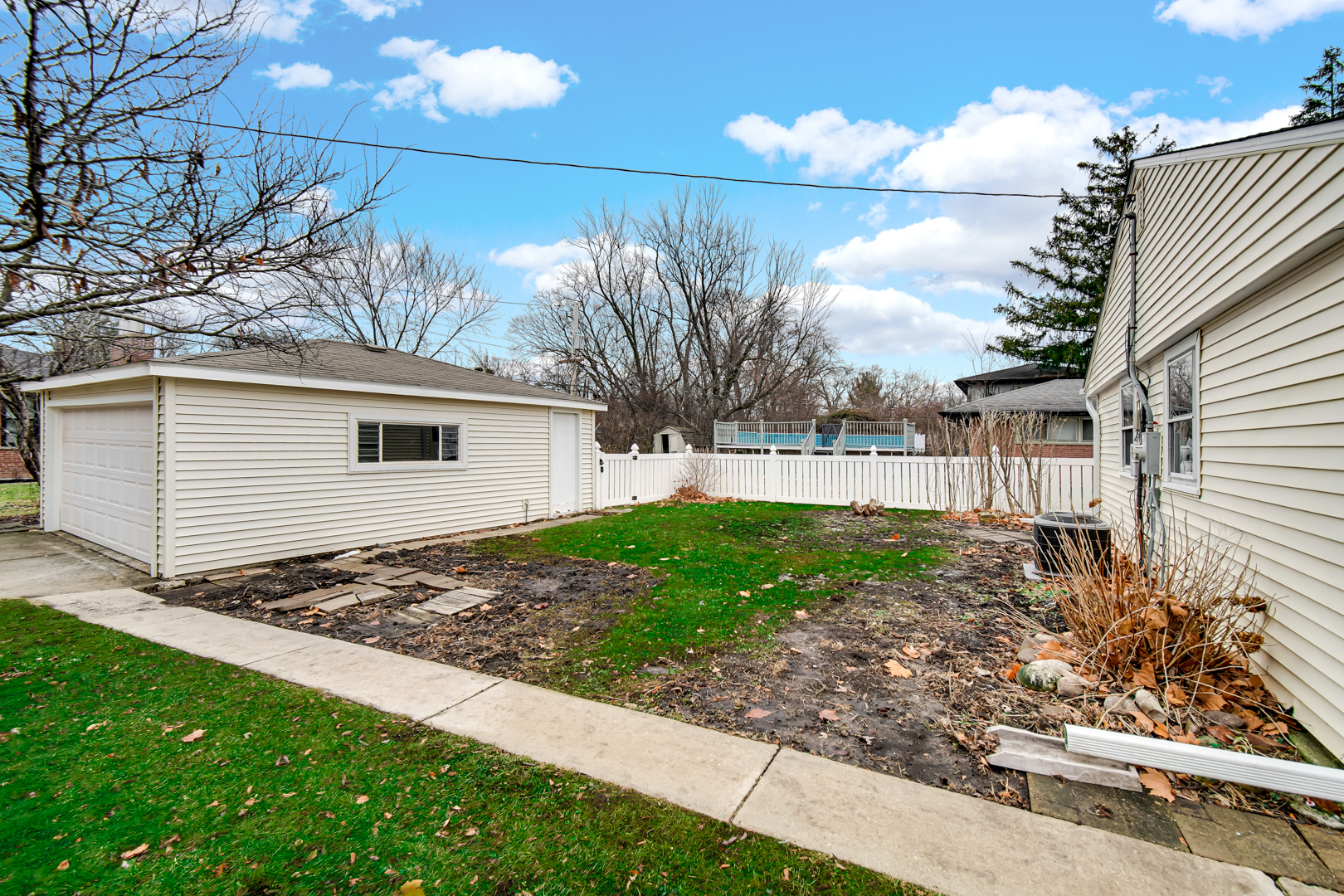 1522 186th Street Homewood, IL 60430 - Photo 22 of 22 a view of a backyard with plants and large trees