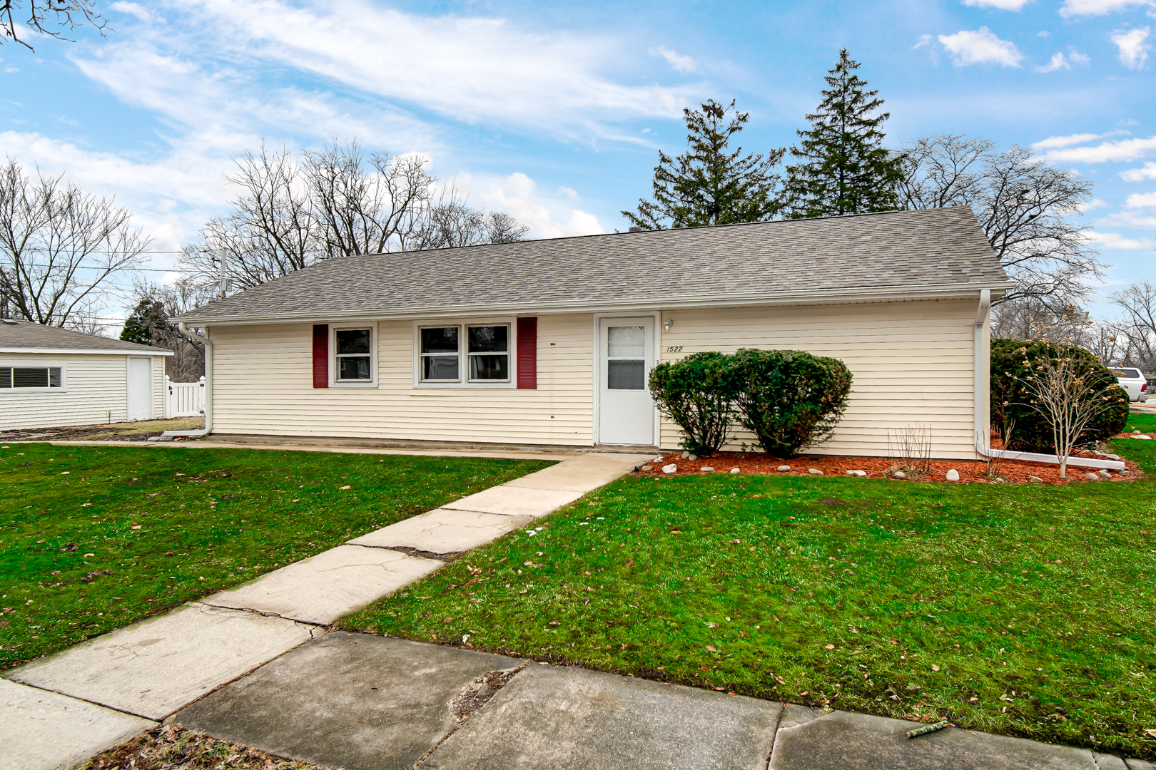 1522 186th Street Homewood, IL 60430 - Photo 3 of 22 a front view of a house with a garden
