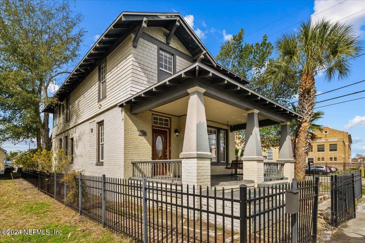 1954 Hubbard Street Jacksonville, FL 32206 - Photo 6 of 30 a view of a house with wooden fence and large trees