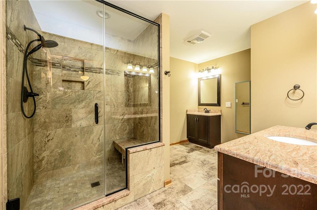 6265 Oxford School Road Claremont, NC 28610 - Photo 14 of 30 a bathroom with a shower and a sink