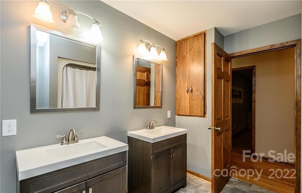 6265 Oxford School Road Claremont, NC 28610 - Photo 17 of 30 a bathroom with a sink and a mirror