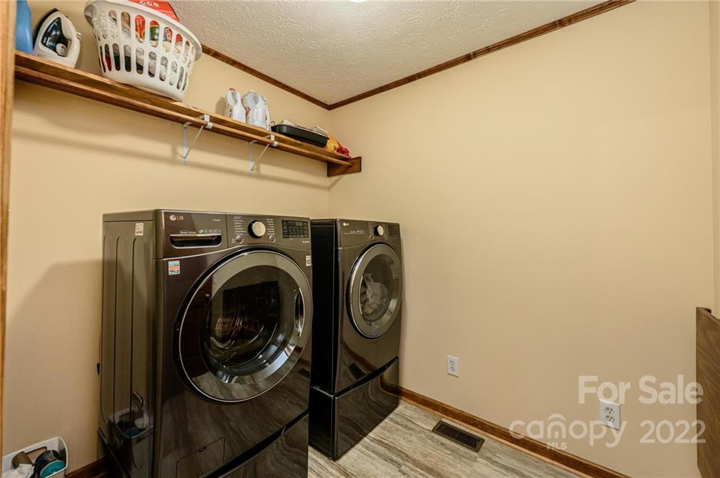6265 Oxford School Road Claremont, NC 28610 - Photo 19 of 30 a utility room with dryer and washer