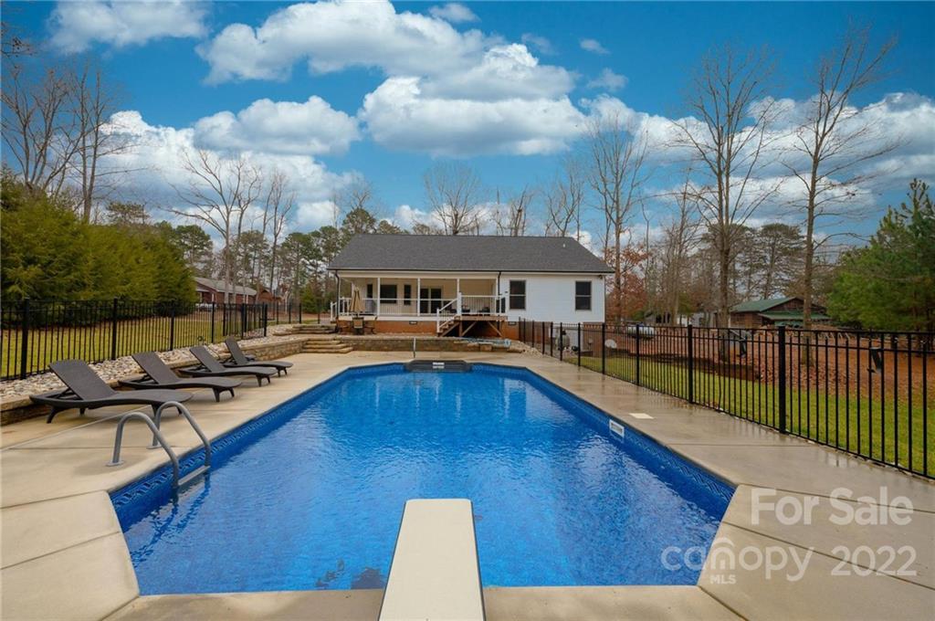 6265 Oxford School Road Claremont, NC 28610 - Photo 2 of 30 a view of swimming pool with outdoor seating