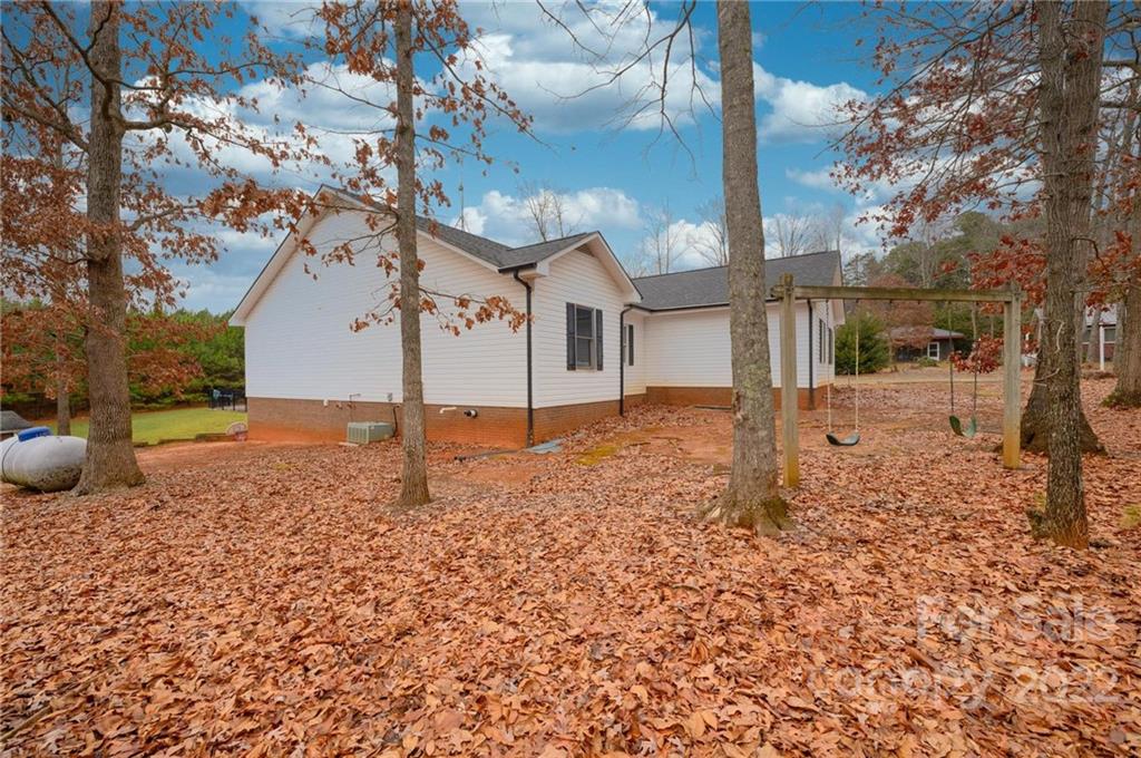 6265 Oxford School Road Claremont, NC 28610 - Photo 29 of 30 a view of a house with a yard