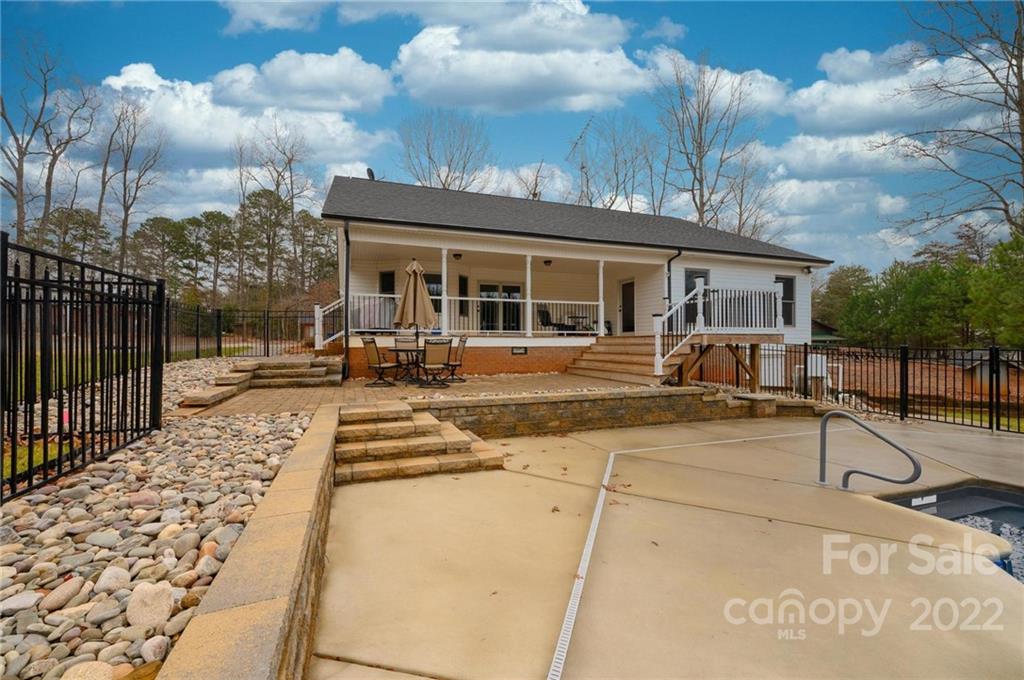 6265 Oxford School Road Claremont, NC 28610 - Photo 5 of 30 a view of a house with a patio