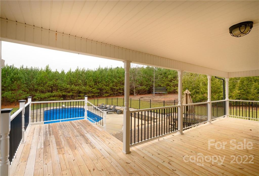 6265 Oxford School Road Claremont, NC 28610 - Photo 6 of 30 a view of a balcony with wooden floor