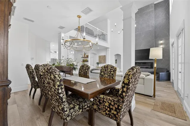 a view of a house with a yard and potted plants