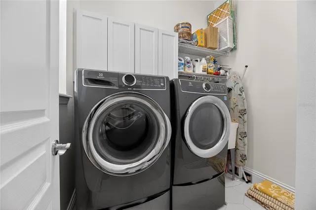 an aerial view of residential house with outdoor space and swimming pool