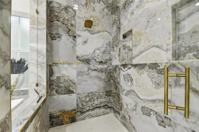 a vase of flowers sitting in front of a house