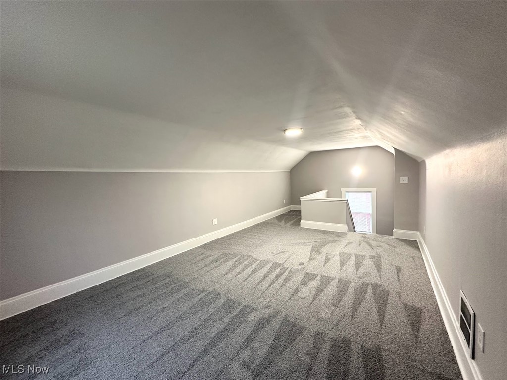 3393 Kildare Road Cleveland, OH 44118 - Photo 13 of 15 Bonus room featuring carpet flooring and vaulted ceiling