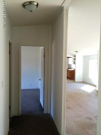 7820 Ranchette Road Keystone Heights, FL 32656 - Photo 12 of 19 a view of a kitchen from the hallway