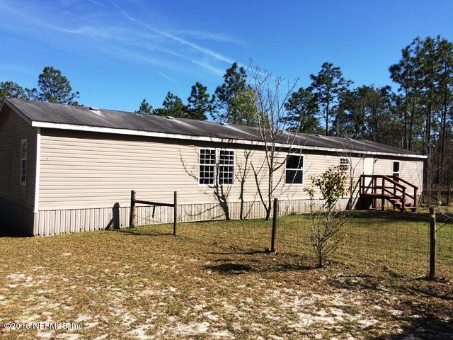 7820 Ranchette Road Keystone Heights, FL 32656 - Photo 19 of 19 a house view with a backyard space