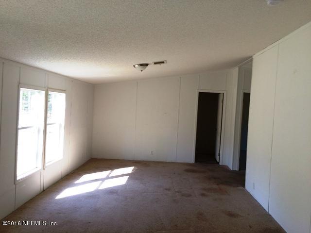 7820 Ranchette Road Keystone Heights, FL 32656 - Photo 6 of 19 a view of empty room with window