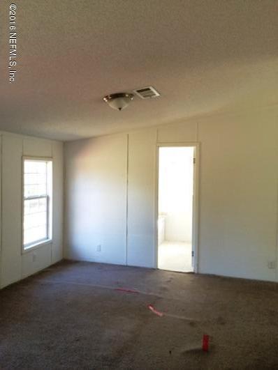 7820 Ranchette Road Keystone Heights, FL 32656 - Photo 7 of 19 an empty room with windows