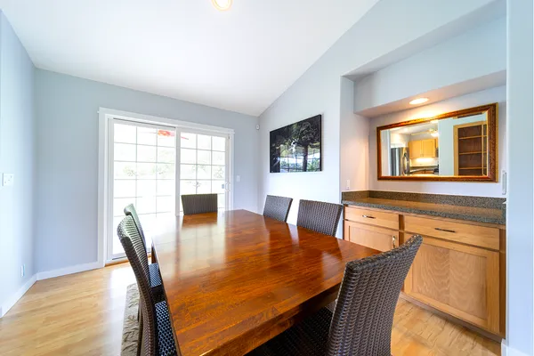 a view of a dining room with furniture and window