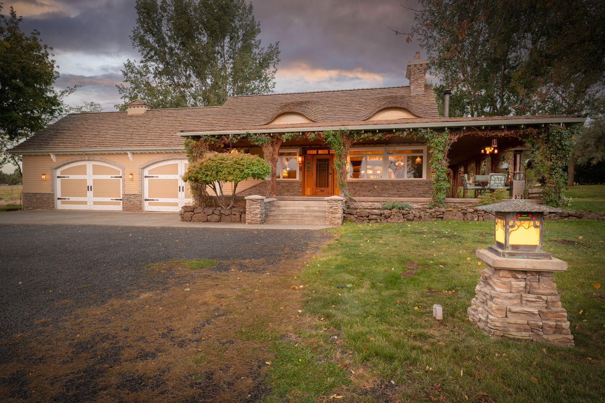 21925 Bear Creek Road Bend, OR 97702 - Photo 4 of 104 Beautiful Bear Creek Ranch w/4 car garage, fully landscaped and hand forged lighting
