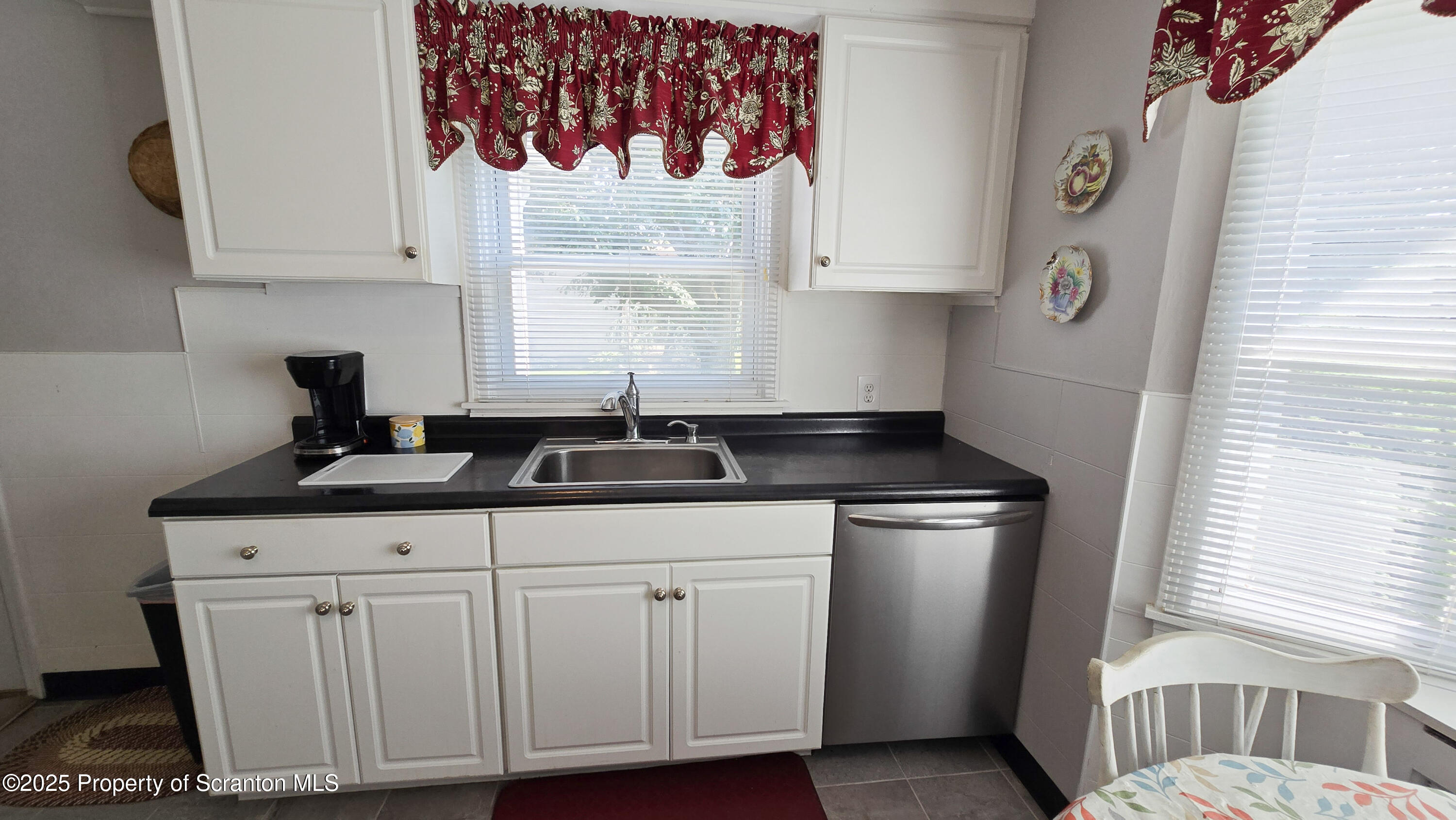 205 Carter Street Old Forge, PA 18518 - Photo 12 of 25 a kitchen with stainless steel appliances granite countertop a sink and a window