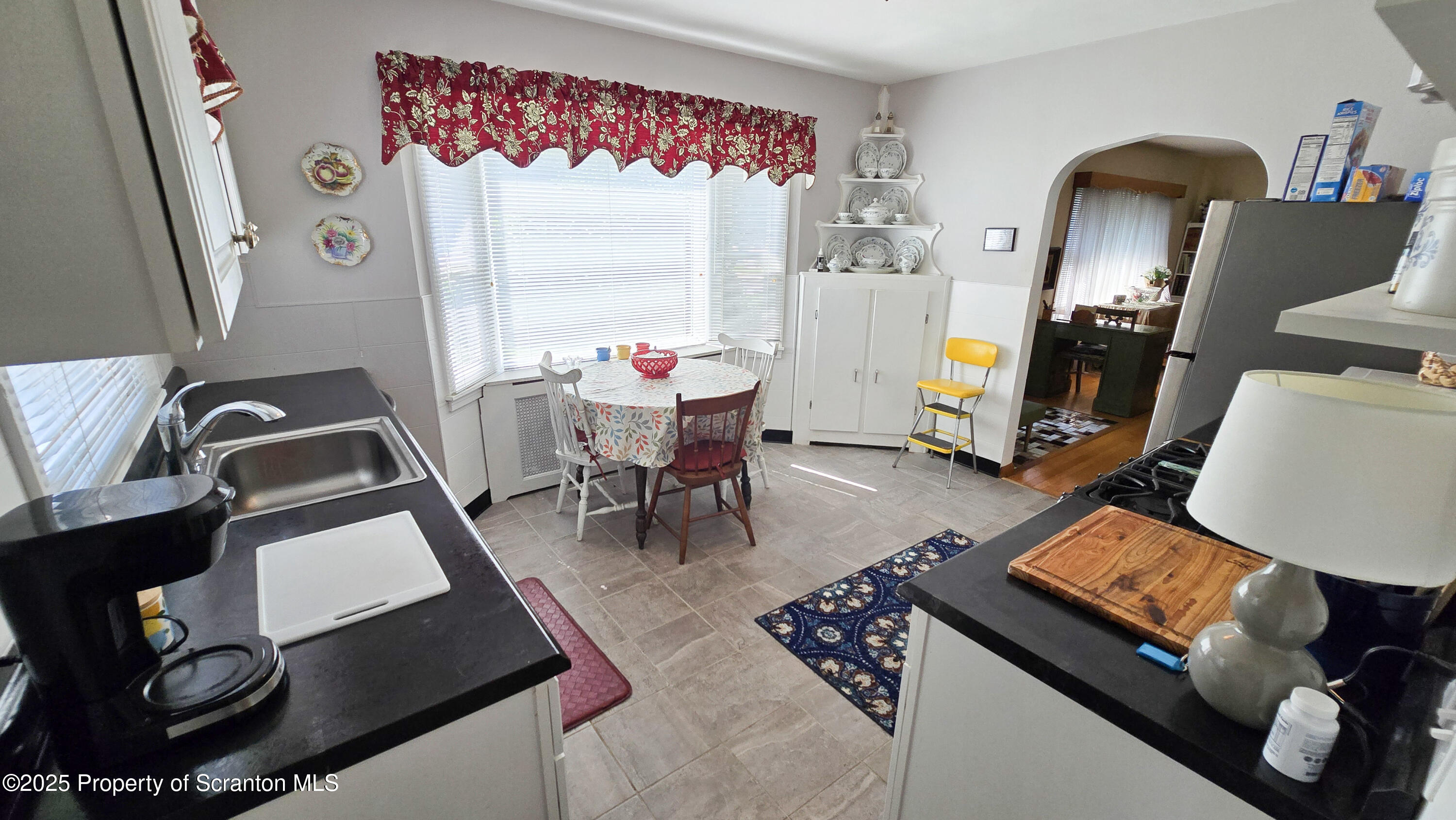 205 Carter Street Old Forge, PA 18518 - Photo 13 of 25 a living room with furniture and a window