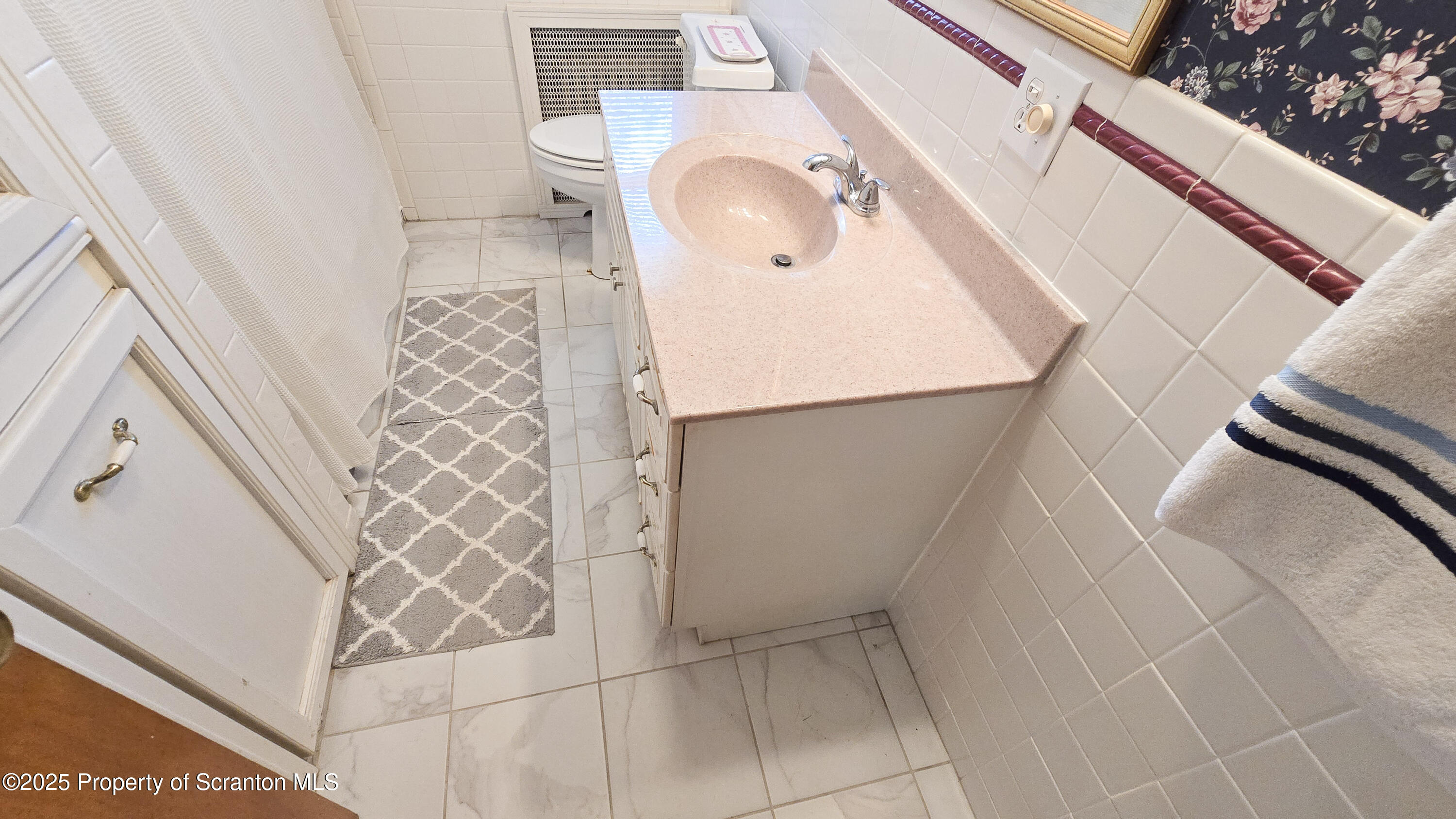 205 Carter Street Old Forge, PA 18518 - Photo 18 of 25 a bathroom with a sink and toilet