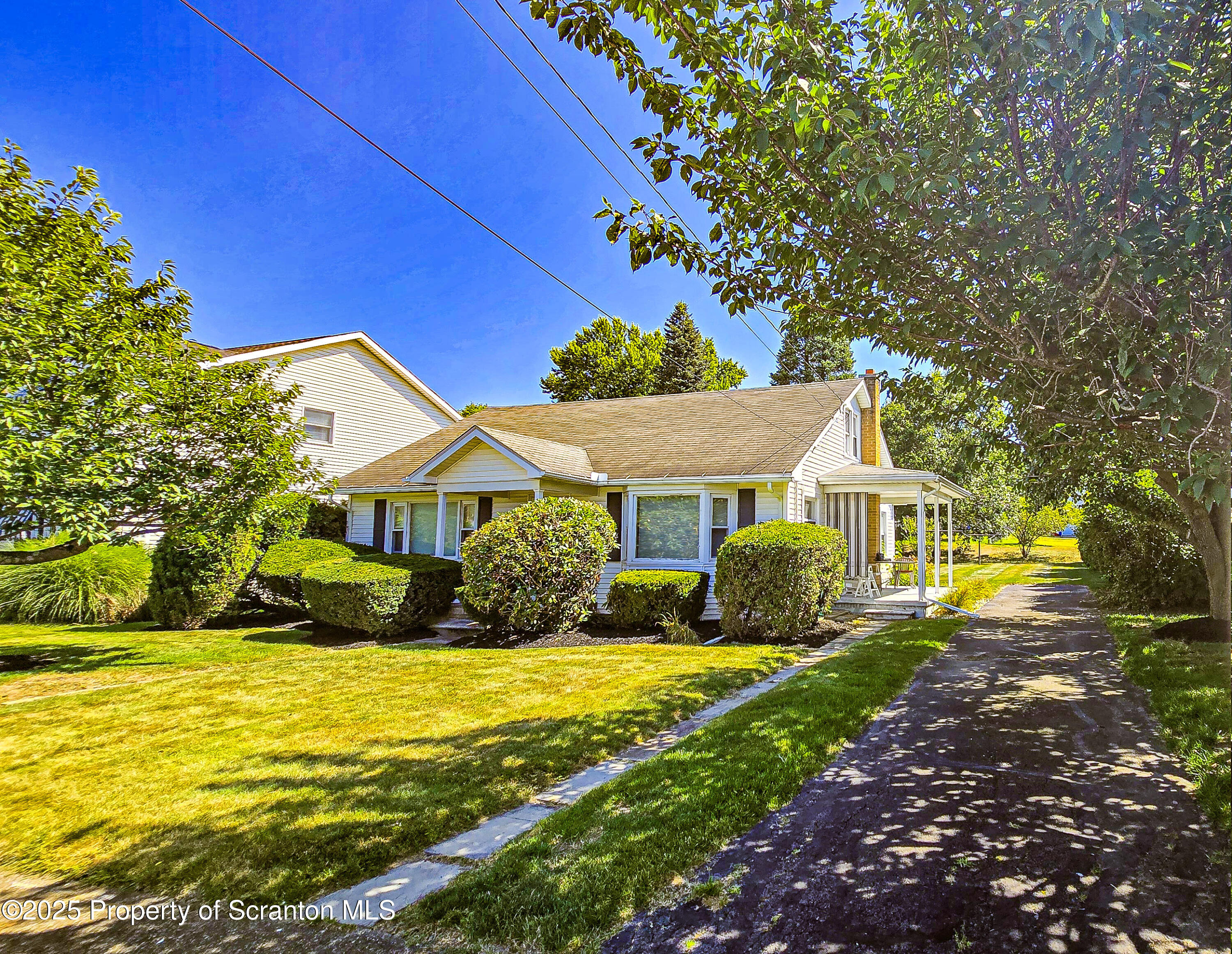 205 Carter Street Old Forge, PA 18518 - Photo 2 of 25 a front view of a house with garden