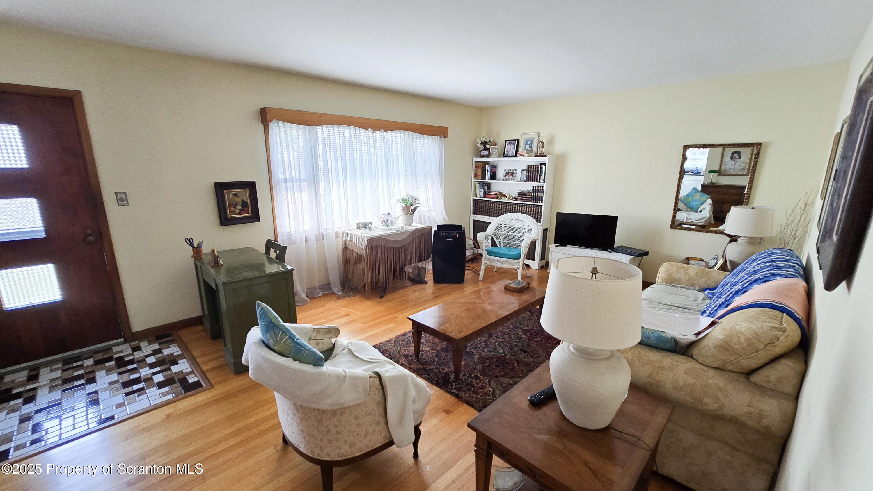 205 Carter Street Old Forge, PA 18518 - Photo 7 of 25 a dining room with furniture a rug and a window