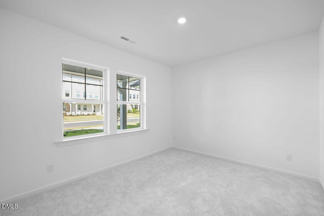 430 Rowe Way Knightdale, NC 27545 - Photo 3 of 51 an empty room with a window