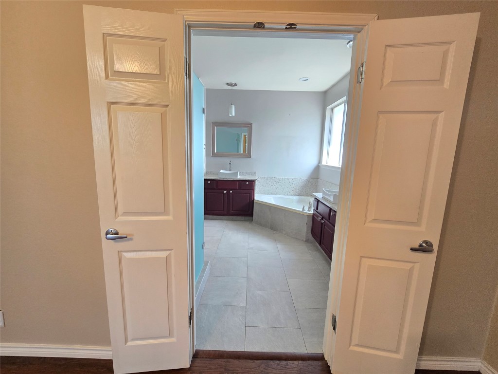 2216 Shark Loop Round Rock, TX 78664 - Photo 16 of 27 a bathroom with a sink and a mirror