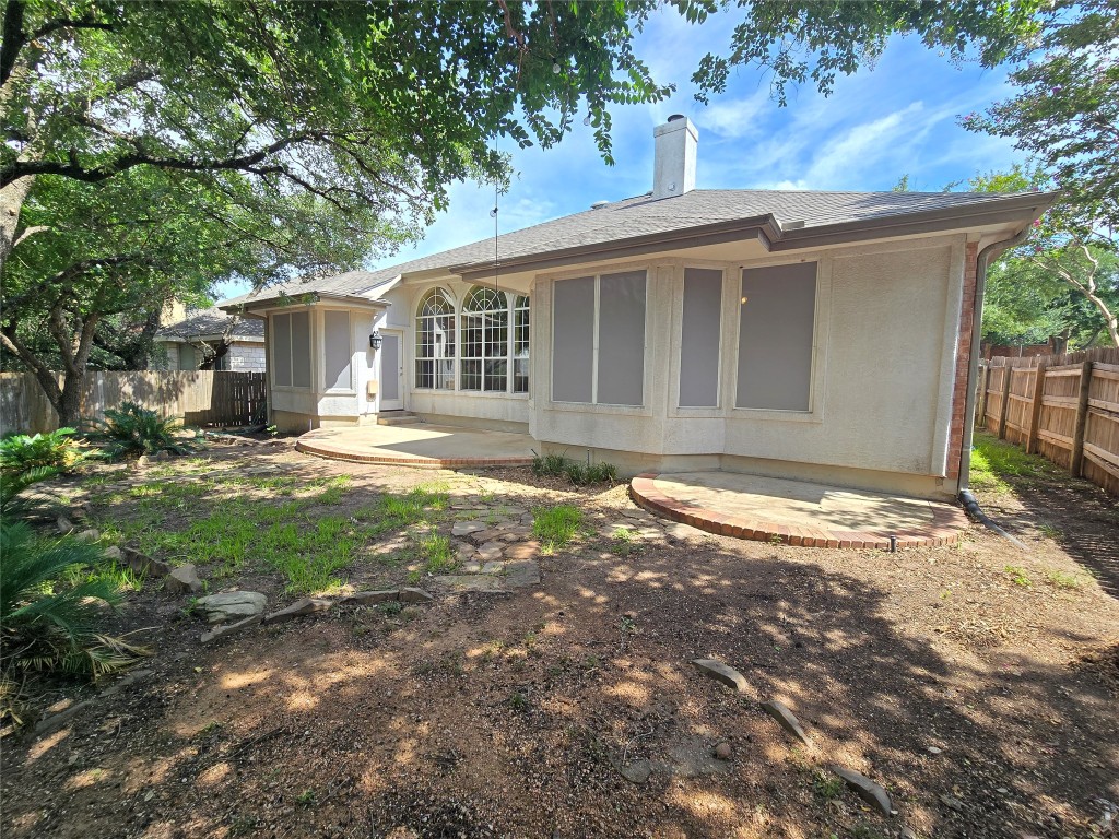2216 Shark Loop Round Rock, TX 78664 - Photo 24 of 27 a backyard of a house with yard and outdoor seating