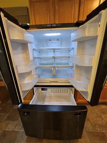 a stove top oven sitting inside of a kitchen
