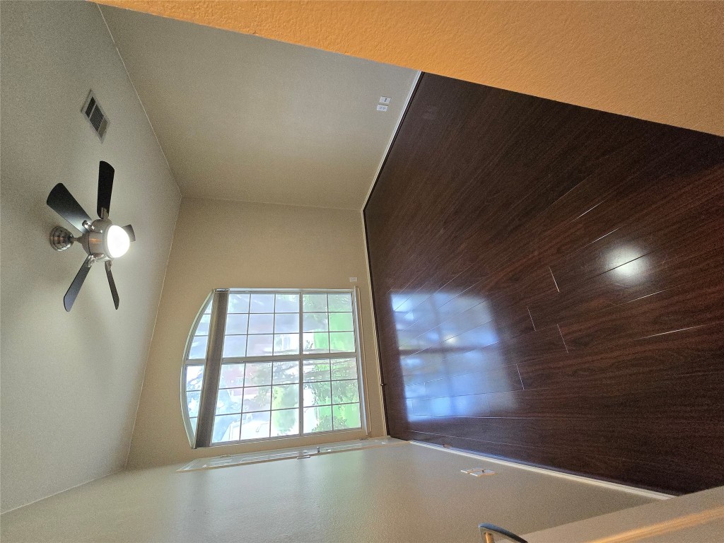 2216 Shark Loop Round Rock, TX 78664 - Photo 7 of 27 wooden floor in an empty room with a window