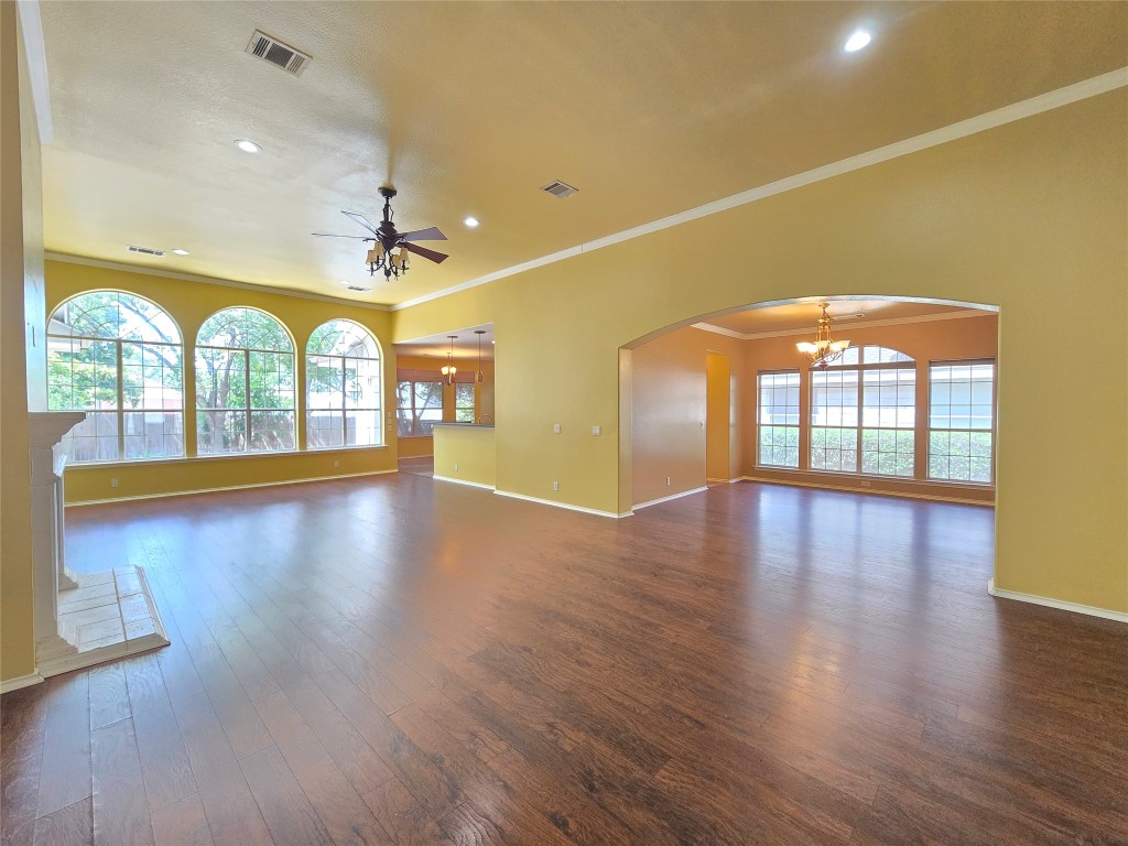 2216 Shark Loop Round Rock, TX 78664 - Photo 10 of 27 an empty room with wooden floor and windows