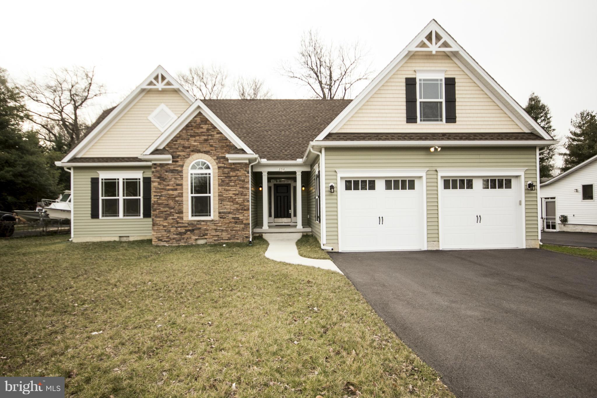 254 Nanticoke Road Baltimore, MD 21221 - Photo 1 of 30 a front view of a house with a garden