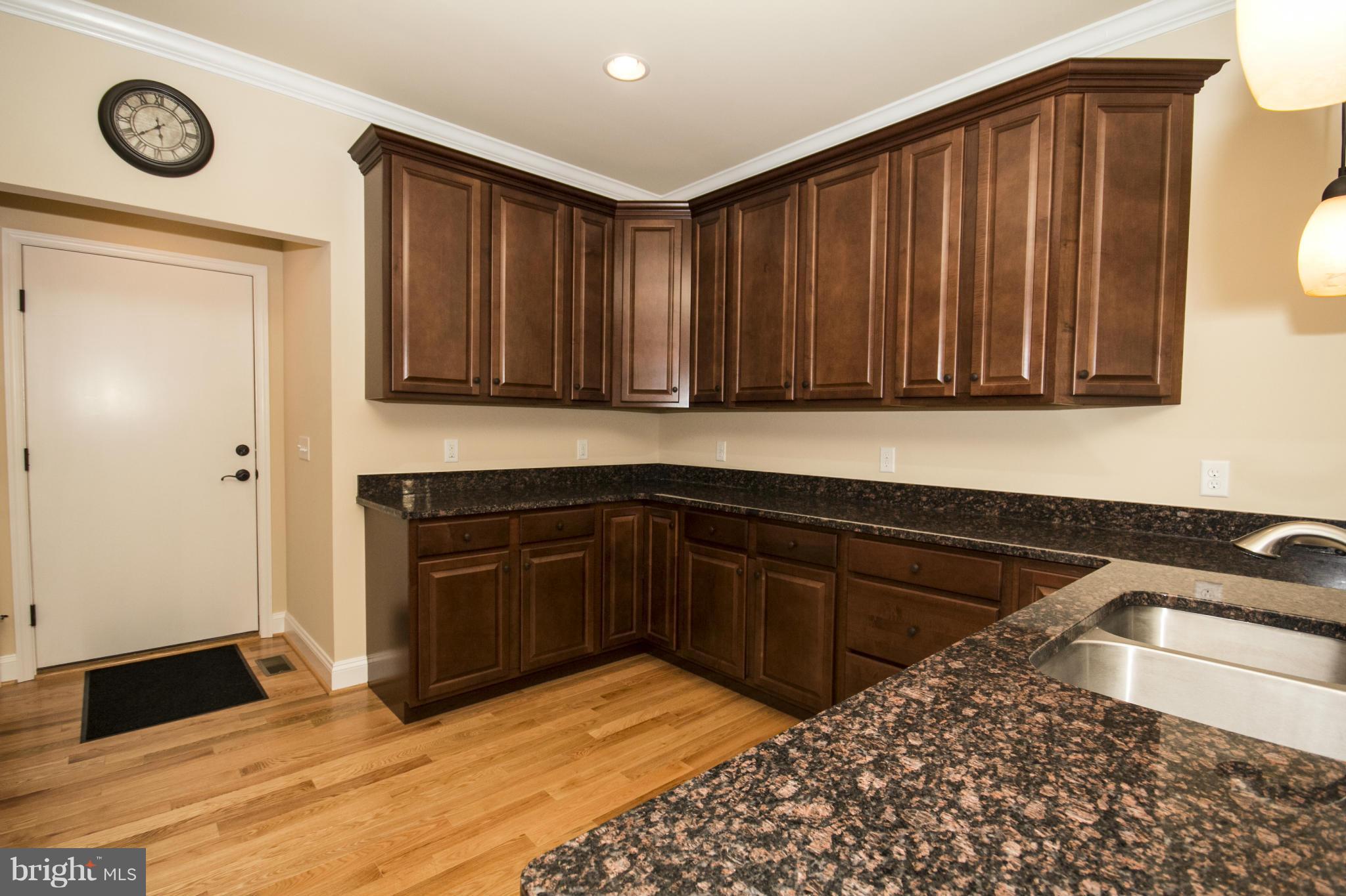 254 Nanticoke Road Baltimore, MD 21221 - Photo 11 of 30 a kitchen with a sink and cabinets