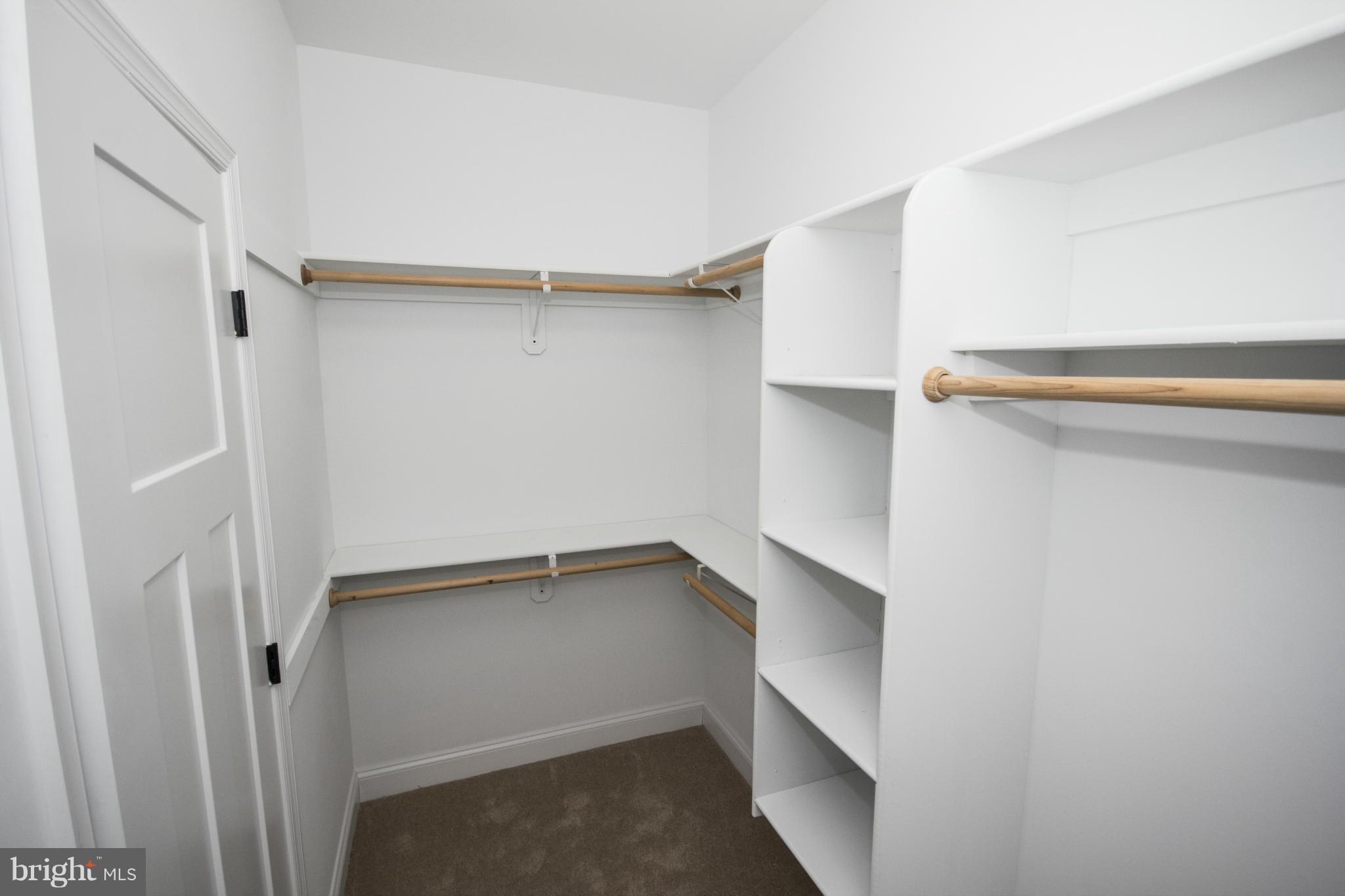 254 Nanticoke Road Baltimore, MD 21221 - Photo 17 of 30 a view of walk in closet with empty racks