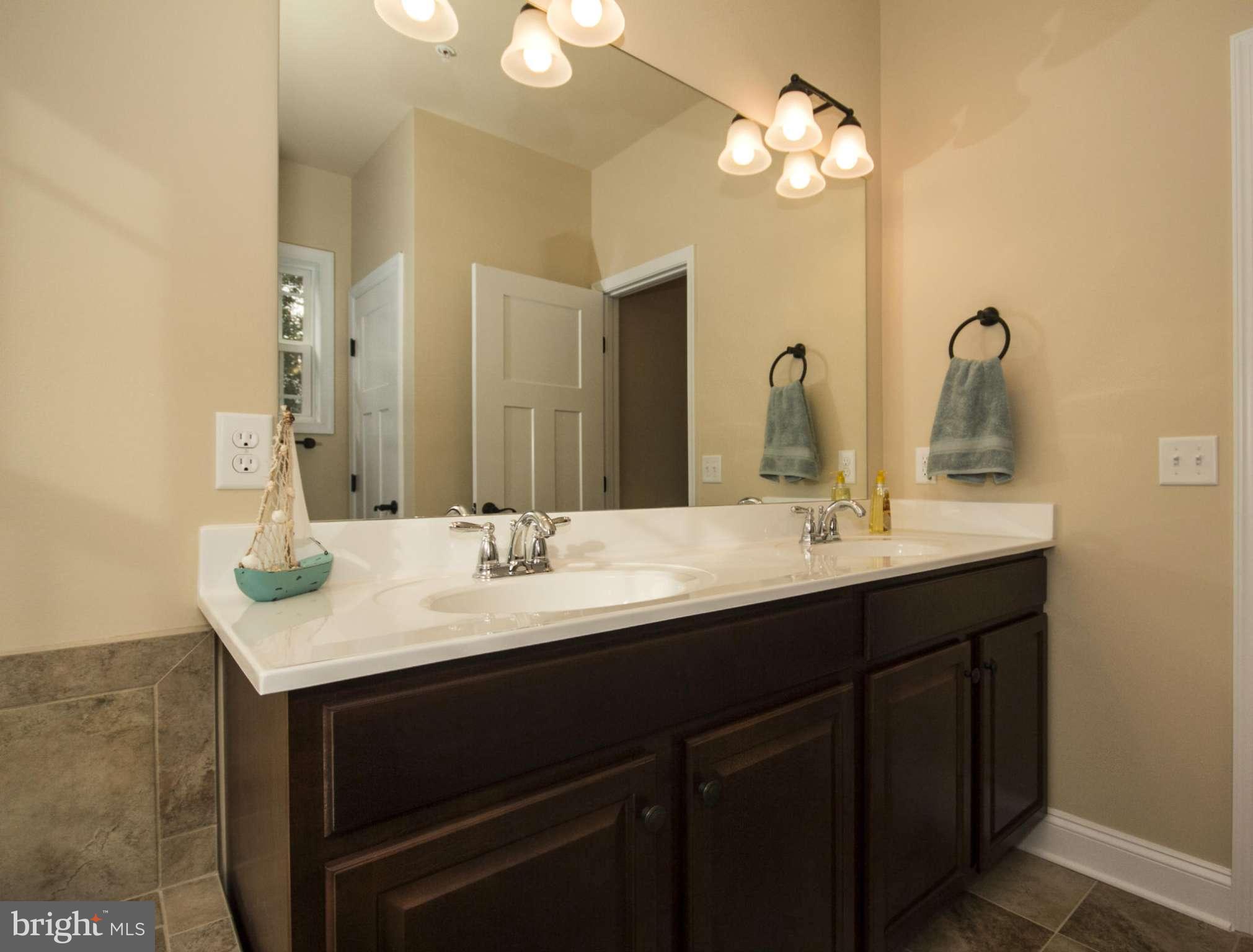 254 Nanticoke Road Baltimore, MD 21221 - Photo 20 of 30 a bathroom with a sink and a mirror