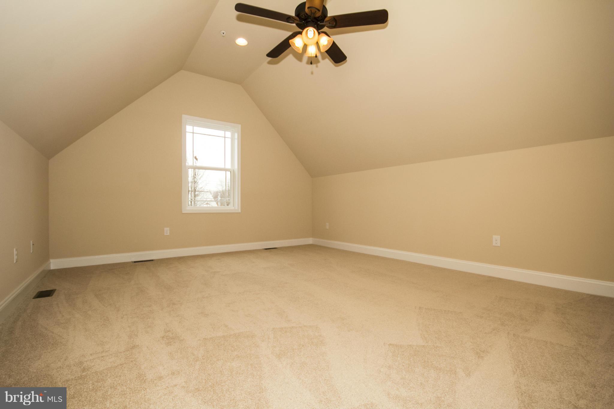 254 Nanticoke Road Baltimore, MD 21221 - Photo 25 of 30 an empty room with a window and a ceiling fan