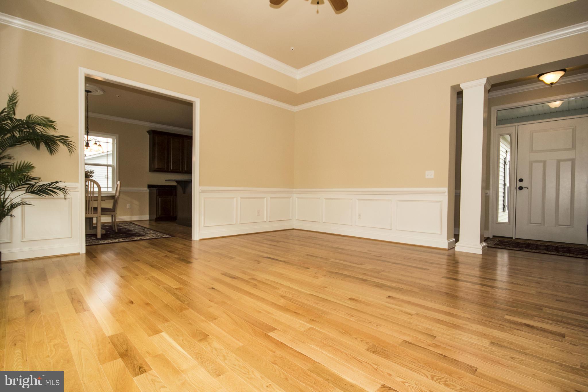 254 Nanticoke Road Baltimore, MD 21221 - Photo 4 of 30 a view of empty room with wooden floor and fan