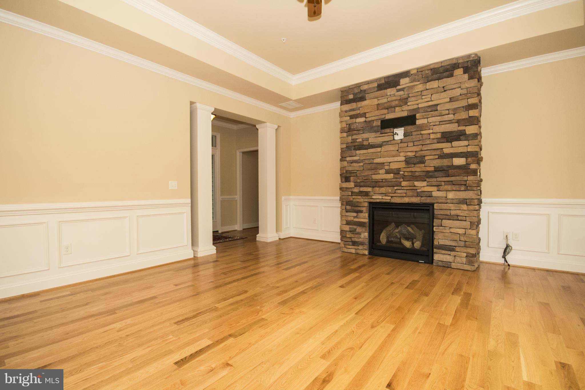 254 Nanticoke Road Baltimore, MD 21221 - Photo 5 of 30 a view of an empty room with wooden floor