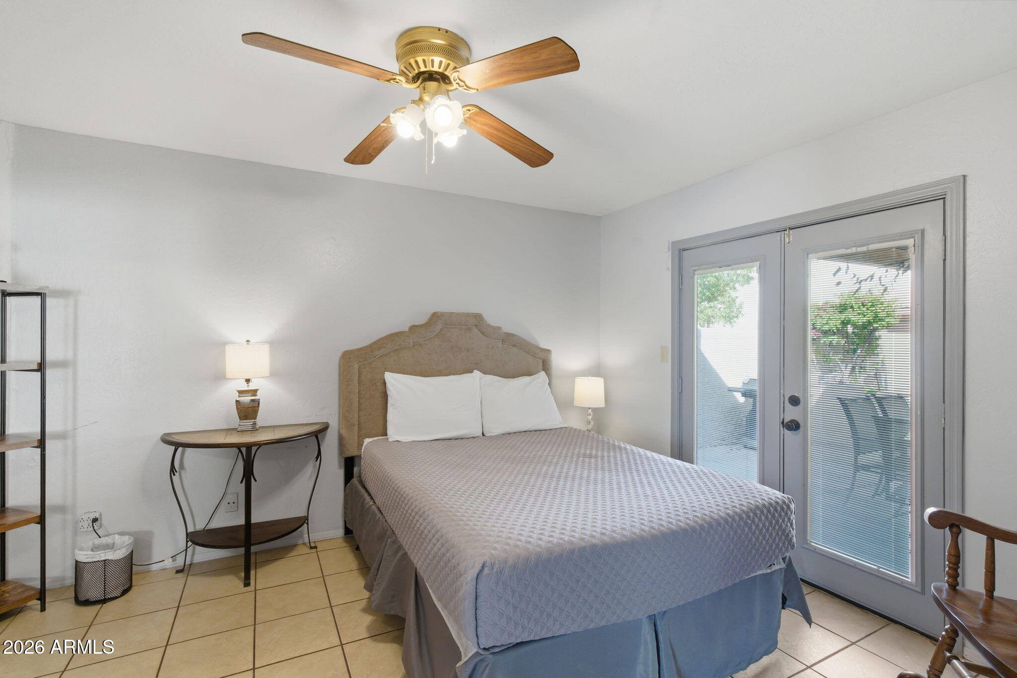 4218 West Boca Raton Road Phoenix, AZ 85053 - Photo 15 of 27 a bedroom with a bed and a chandelier