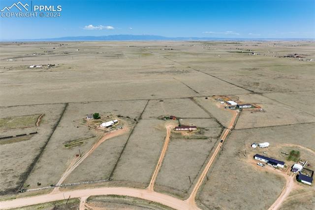 6240 Night Train Lane Yoder, CO 80864 - Photo 50 of 50 Drone / aerial view featuring a rural view