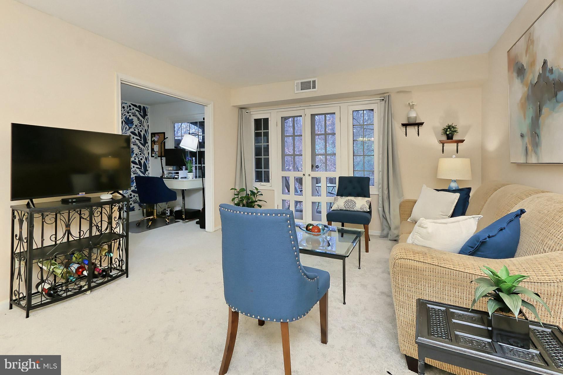 5907 D Noblestown Road, Unit 66 Springfield, VA 22152 - Photo 8 of 53 Living room with opening to den