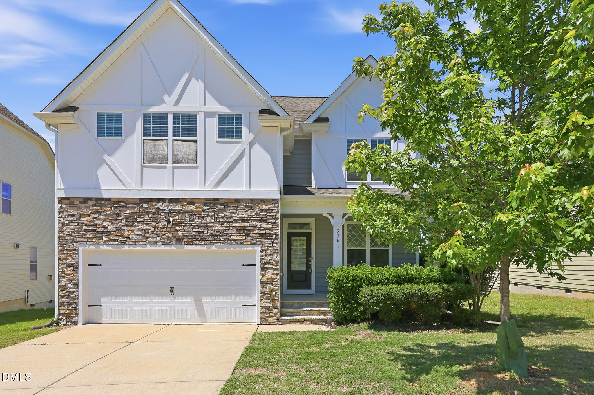336 Plott Hound Lane Wake Forest, NC 27587 - Photo 1 of 39 a front view of a house with a garden