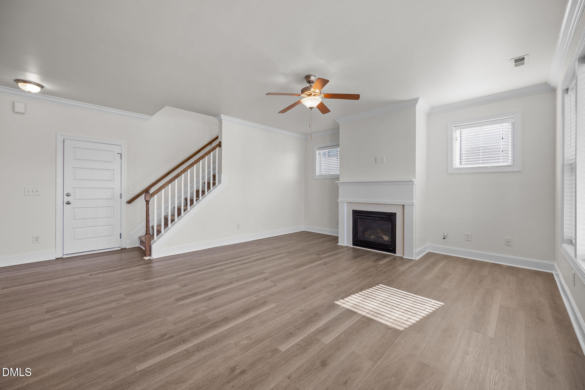 336 Plott Hound Lane Wake Forest, NC 27587 - Photo 13 of 39 wooden floor fireplace and windows in a room