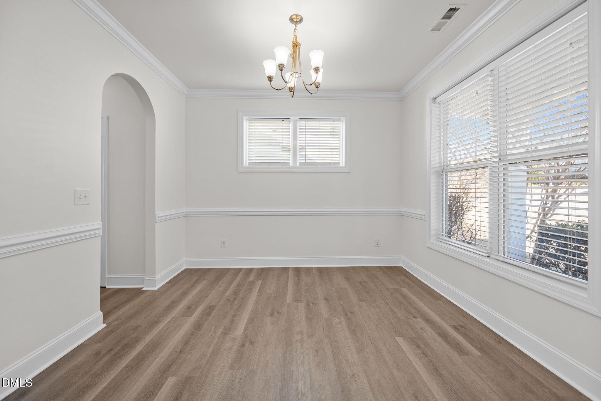 336 Plott Hound Lane Wake Forest, NC 27587 - Photo 15 of 39 wooden floor in an empty room with a window