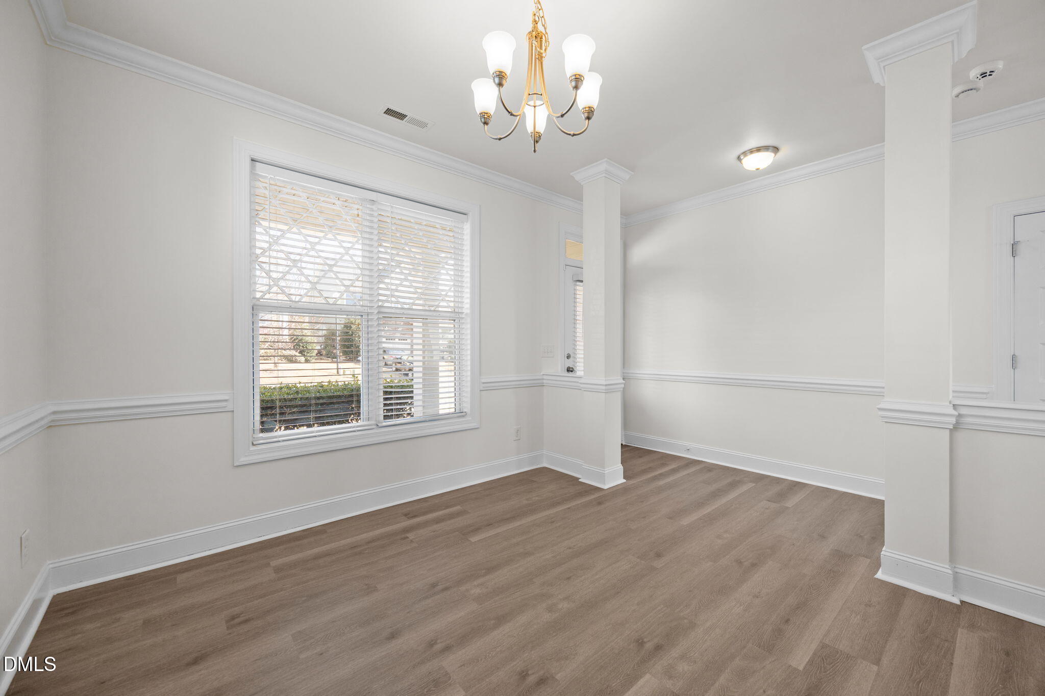 336 Plott Hound Lane Wake Forest, NC 27587 - Photo 16 of 39 wooden floor in an empty room with a window
