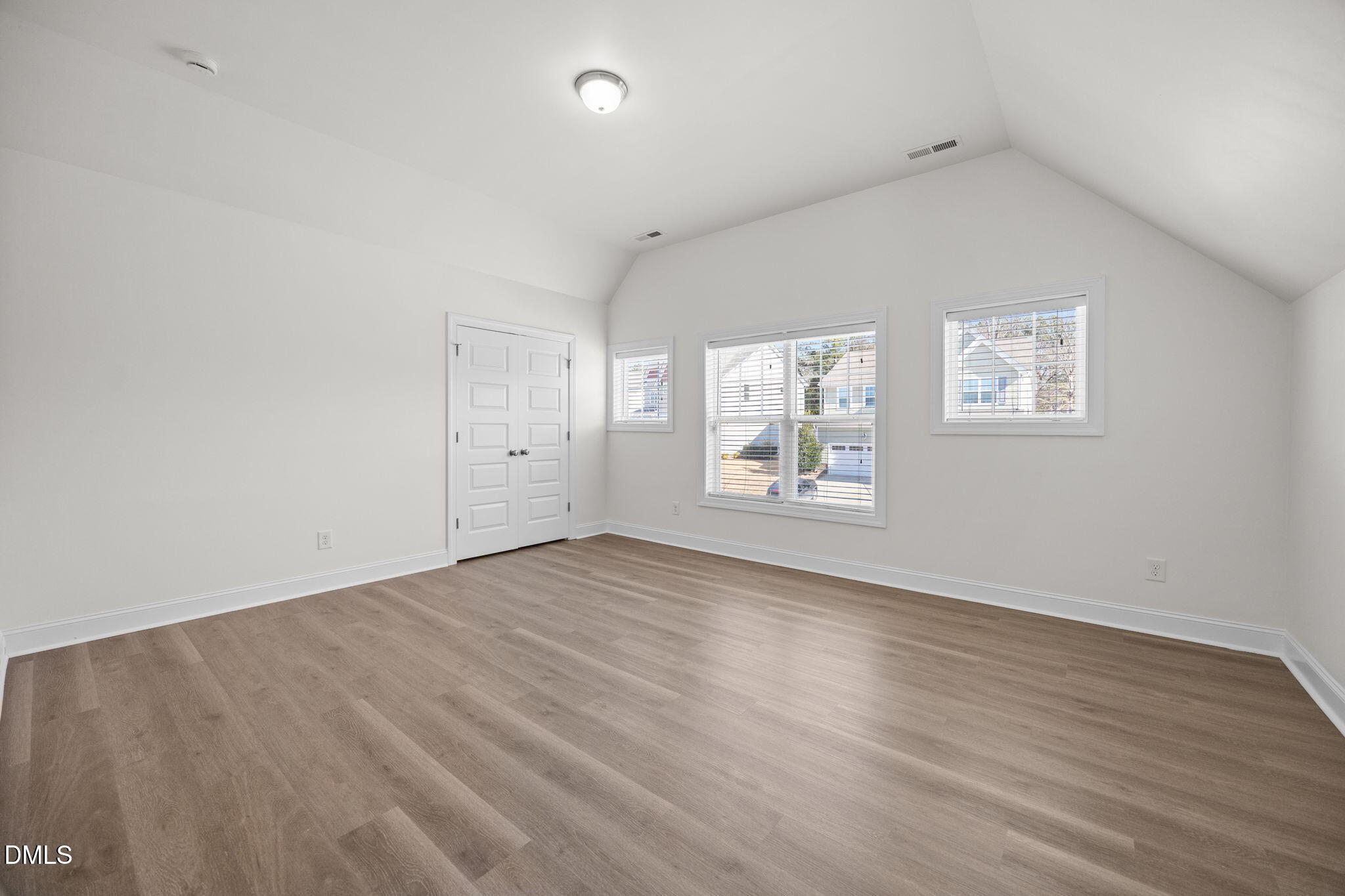 336 Plott Hound Lane Wake Forest, NC 27587 - Photo 19 of 39 an empty room with wooden floor and windows