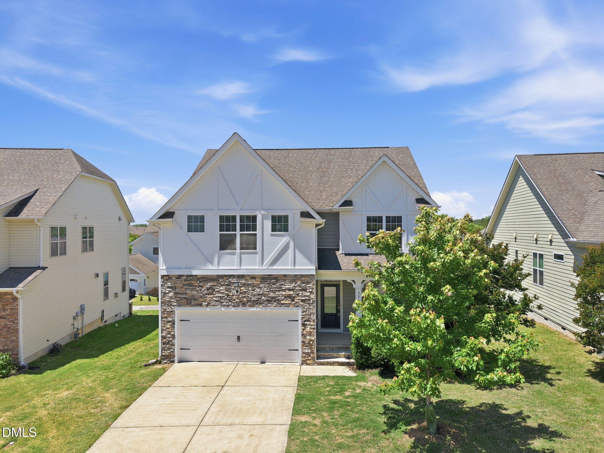 336 Plott Hound Lane Wake Forest, NC 27587 - Photo 2 of 39 a front view of a house with a garden