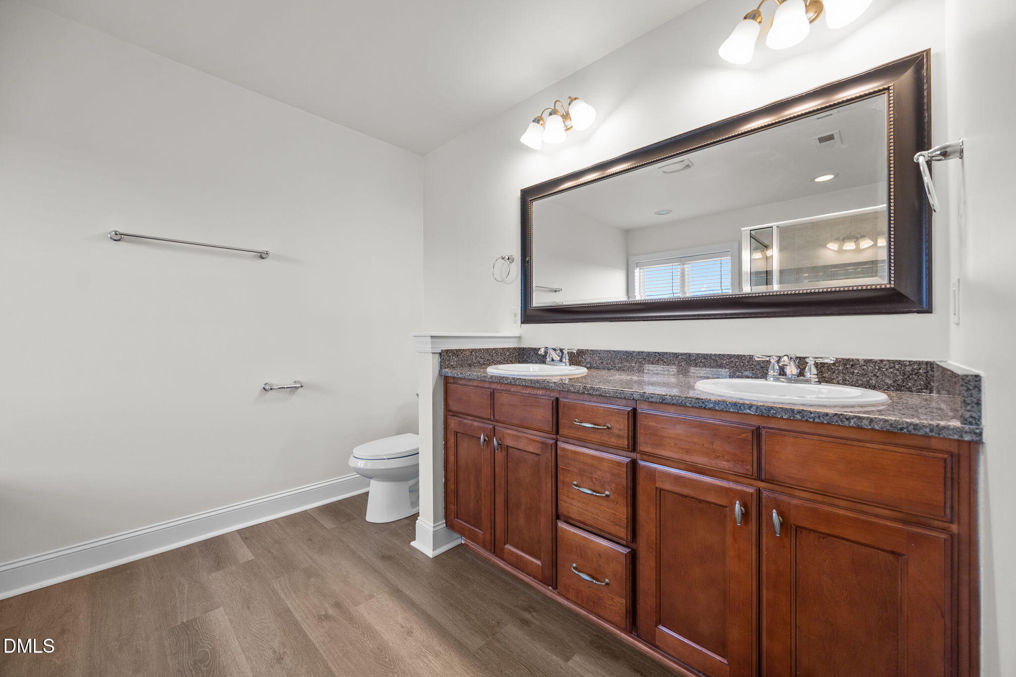 336 Plott Hound Lane Wake Forest, NC 27587 - Photo 23 of 39 a bathroom with a granite countertop toilet sink and mirror